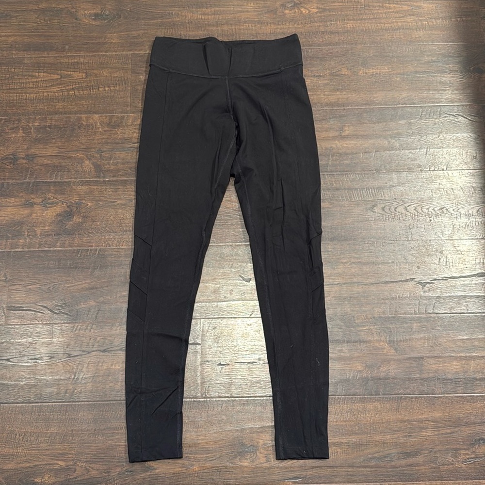 Victoria’s Secret Pink brand black leggings with sheer patches on the legs